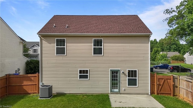 1310 Silver Dr, Mebane, NC 27302 - back of property with central AC, a patio area, and a gate