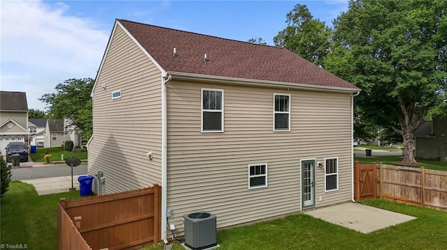 1310 Silver Dr, Mebane, NC 27302 - back of property with central AC and roof with shingles