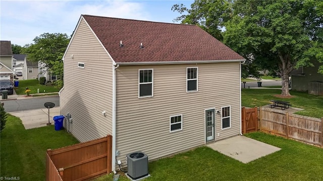 1310 Silver Dr, Mebane, NC 27302 - back of property featuring cooling unit, a patio, and roof with shingles