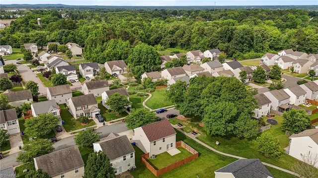 1310 Silver Dr, Mebane, NC 27302 - aerial perspective of suburban area featuring a forest