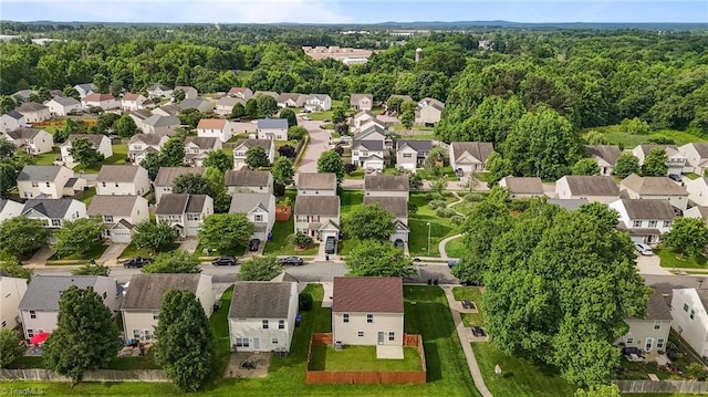1310 Silver Dr, Mebane, NC 27302 - aerial perspective of suburban area featuring a forest