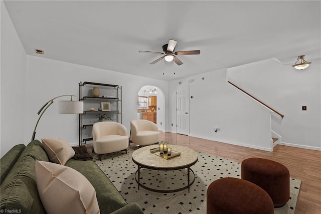 1310 Silver Dr, Mebane, NC 27302 - living room with wood finished floors, ceiling fan, stairs, and baseboards