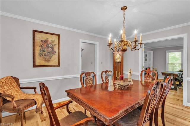 408 Camelot Dr, Salisbury, NC 28144 - dining space with a chandelier, light wood-style flooring, and ornamental molding