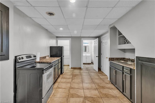 408 Camelot Dr, Salisbury, NC 28144 - kitchen with stainless steel electric stove, open shelves, a paneled ceiling, and freestanding refrigerator