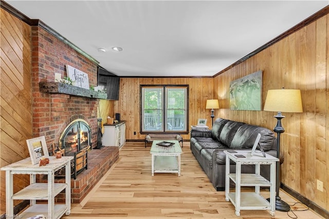 408 Camelot Dr, Salisbury, NC 28144 - living room with light wood-type flooring, wooden walls, a brick fireplace, and ornamental molding
