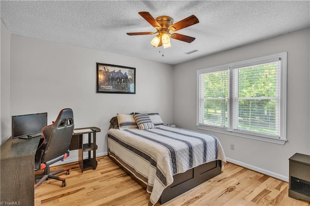 408 Camelot Dr, Salisbury, NC 28144 - bedroom featuring wood finished floors, a textured ceiling, a desk, and ceiling fan