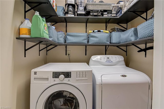 laundry area with independent washer and dryer