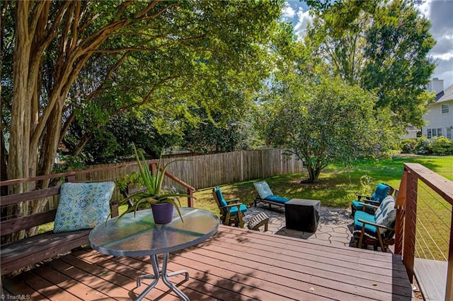 wooden deck with a lawn