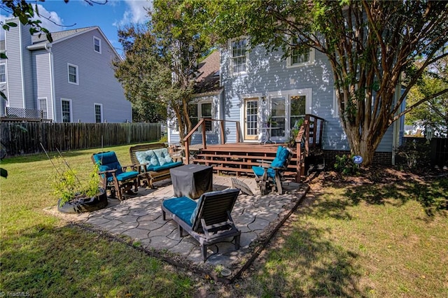 back of property with a patio and a yard