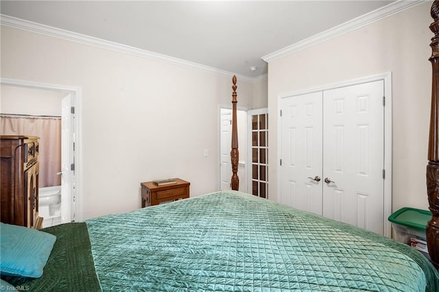 bedroom with a closet, ensuite bath, and ornamental molding