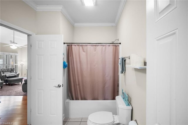 full bathroom with toilet, shower / bath combo, ornamental molding, wood finished floors, and a ceiling fan