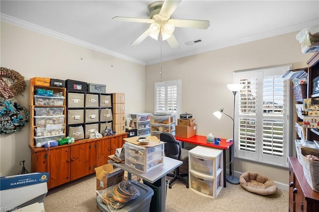 office featuring visible vents, baseboards, a ceiling fan, and ornamental molding