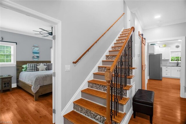 3080 Shiloh Church Rd, Winston-Salem, NC 27105 - stairs featuring wood finished floors, healthy amount of natural light, ceiling fan, ornamental molding, and baseboards