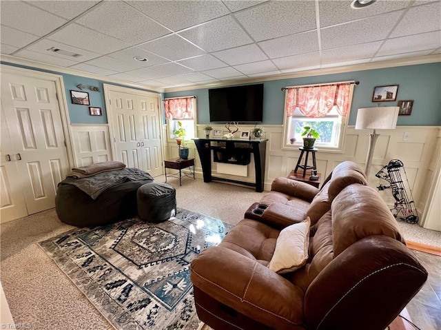 living room with a paneled ceiling