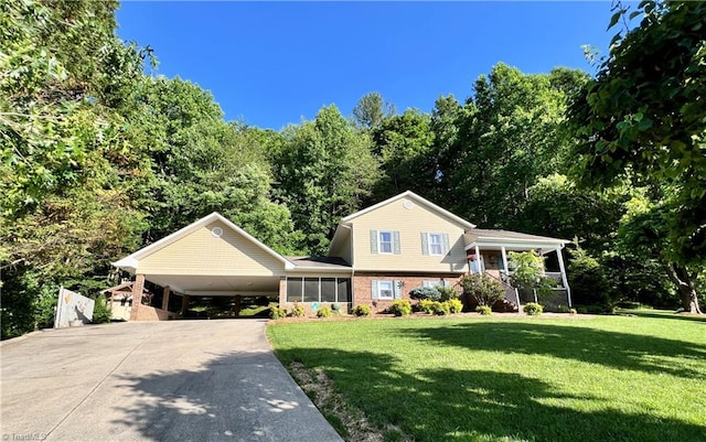 view of front of house with a front lawn and a carport