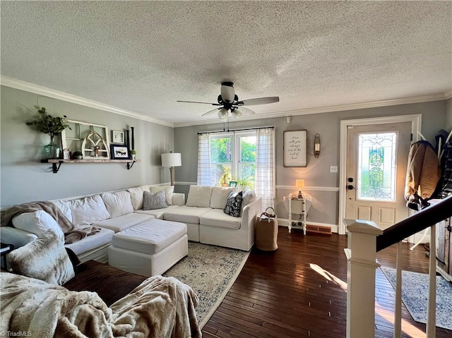 living room featuring plenty of natural light, a textured ceiling, wood-type flooring, and ceiling fan