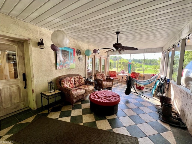 sunroom / solarium with ceiling fan