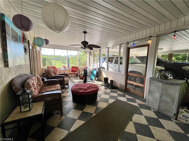 sunroom with ceiling fan and a healthy amount of sunlight