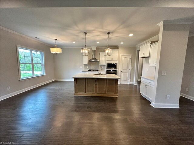 122 Jasper Ct, King, NC 27021 - kitchen with wall chimney range hood, crown molding, recessed lighting, light countertops, and white cabinetry