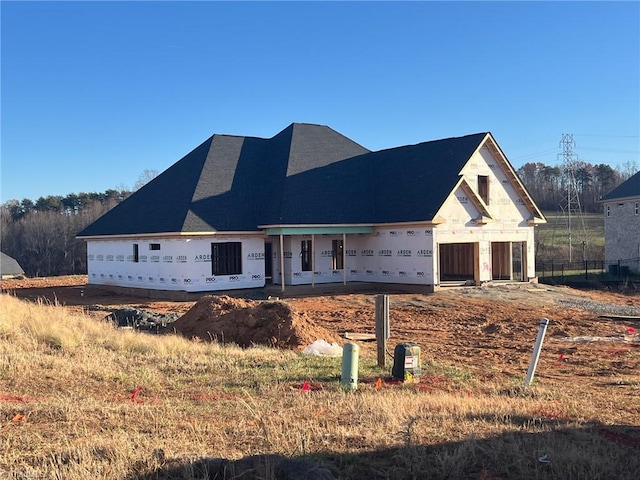 unfinished property with a garage