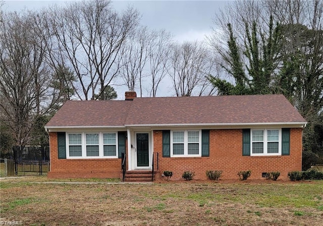 single story home featuring crawl space, a chimney, fence, and brick siding