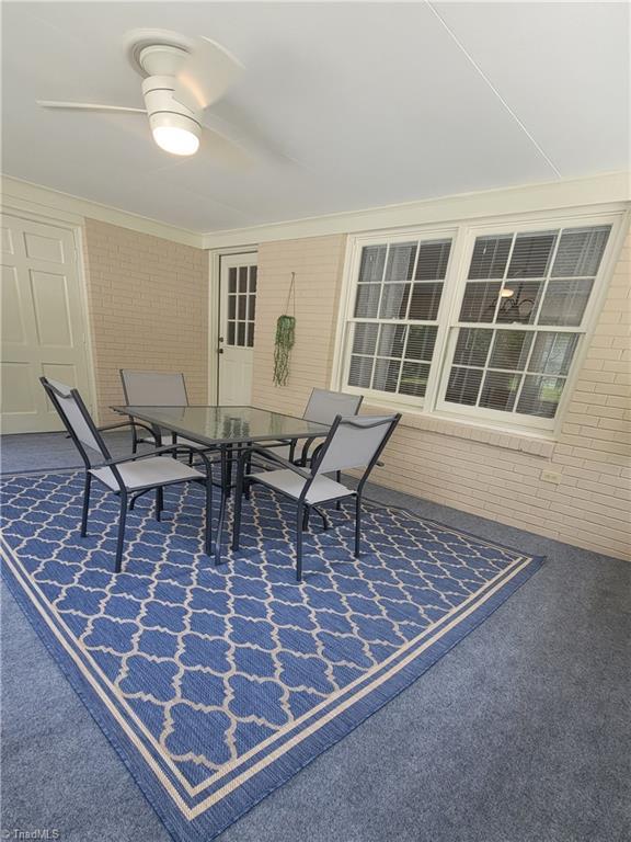 view of patio featuring outdoor dining area