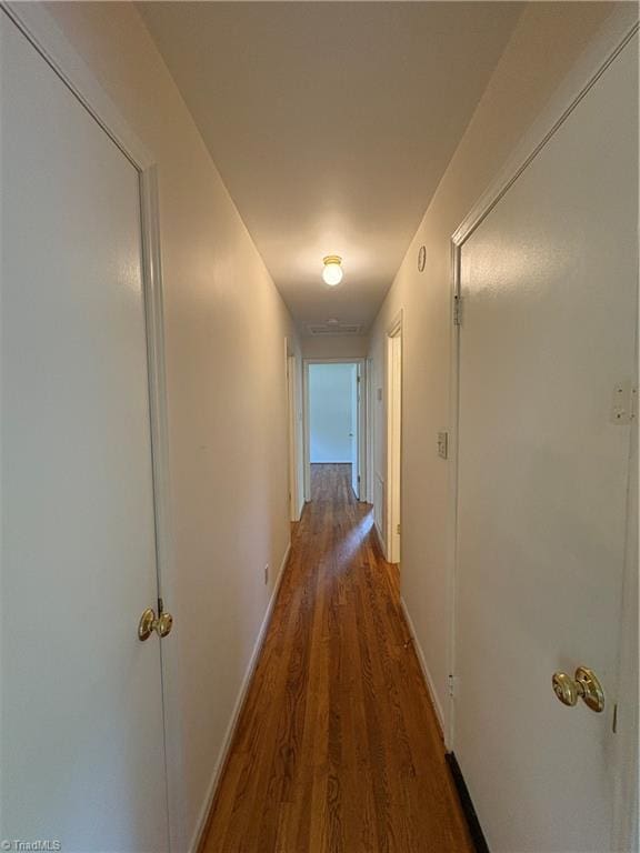 2504 Denise Dr, Greensboro, NC 27407 - corridor featuring wood finished floors and baseboards