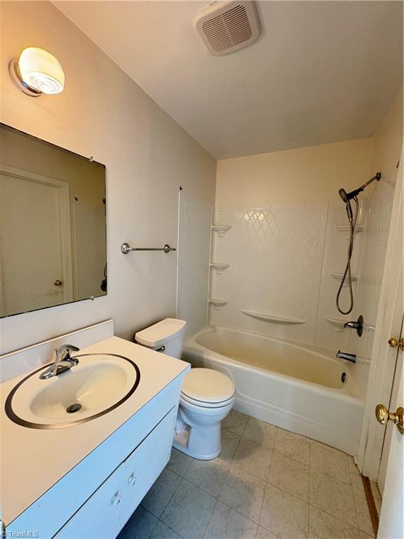 2504 Denise Dr, Greensboro, NC 27407 - bathroom featuring vanity and shower / bath combination