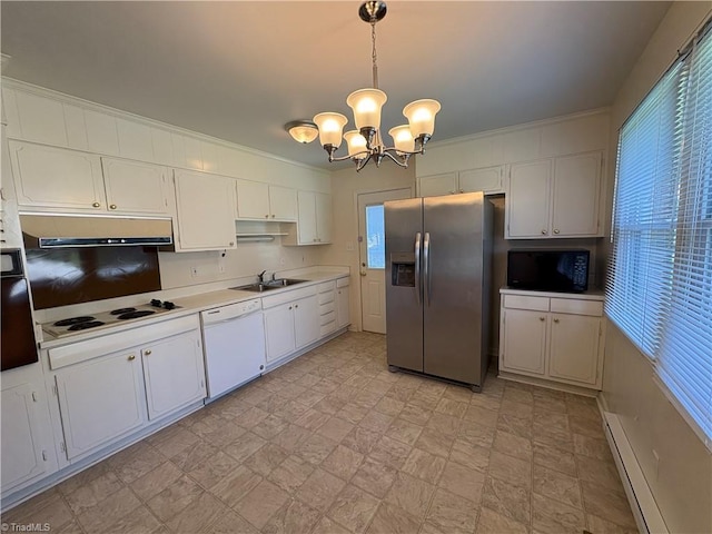 2504 Denise Dr, Greensboro, NC 27407 - kitchen with black appliances, under cabinet range hood, baseboard heating, light countertops, and a chandelier