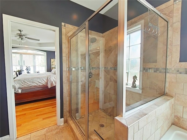 bathroom with tile patterned flooring, ceiling fan, and a shower with shower door