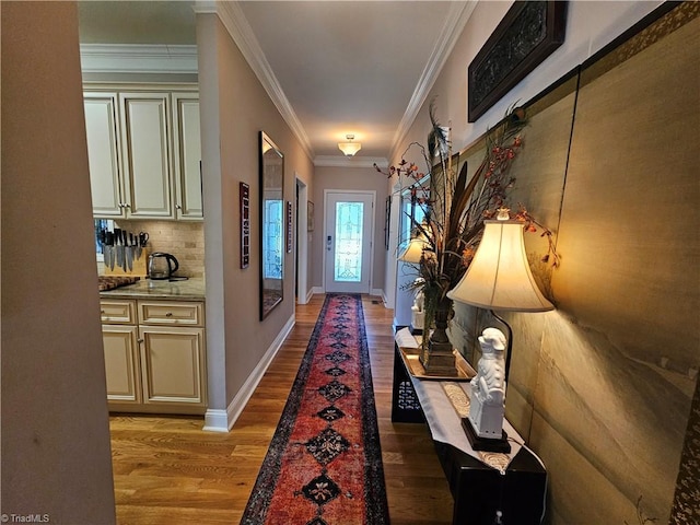 corridor featuring light wood-type flooring and crown molding