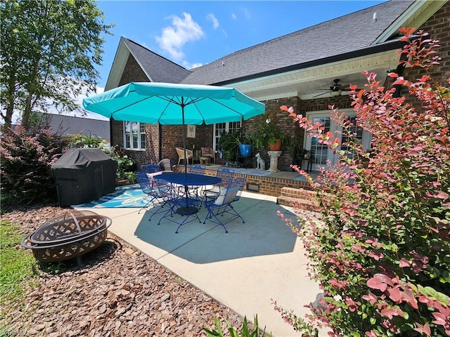 view of patio featuring a fire pit and grilling area