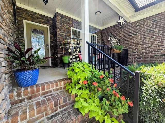 view of exterior entry with a porch