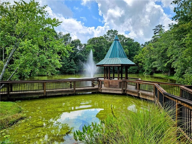 dock area with a gazebo and a water view