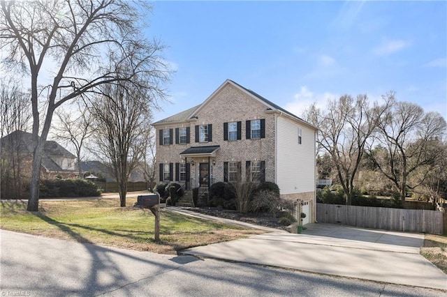 view of front of house with an attached garage, fence, concrete driveway, and brick siding