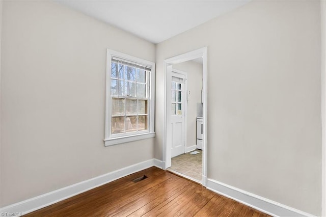 spare room featuring light hardwood / wood-style floors