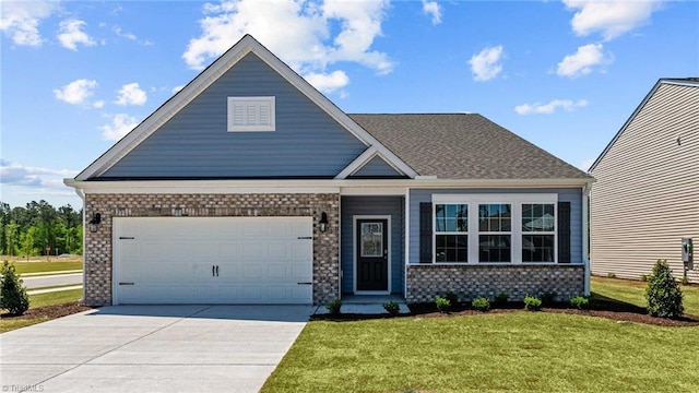 craftsman-style home featuring a garage and a front yard