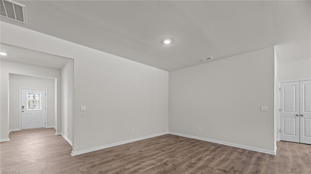 empty room with light hardwood / wood-style floors