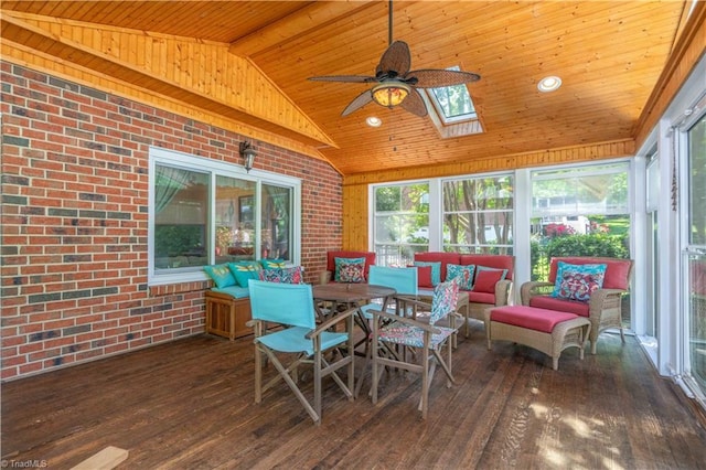 8116 Glengarriff Rd, Clemmons, NC 27012 - sunroom / solarium with brick wall, a skylight, a deck, wood ceiling, and hardwood / wood-style floors