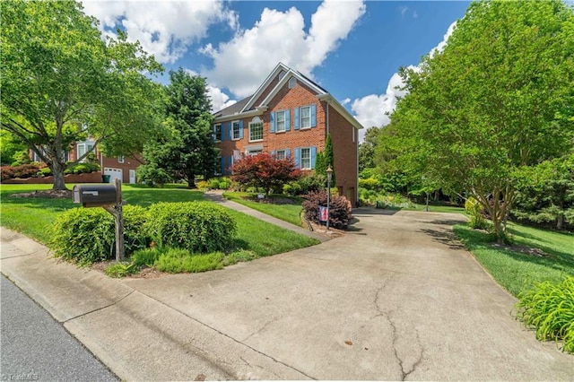 8116 Glengarriff Rd, Clemmons, NC 27012 - view of front of home featuring a front lawn and brick siding