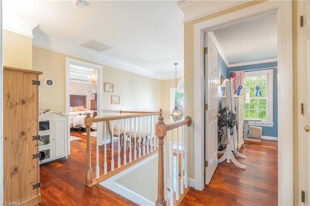 8116 Glengarriff Rd, Clemmons, NC 27012 - hallway featuring an upstairs landing, wood finished floors, ornamental molding, and baseboards