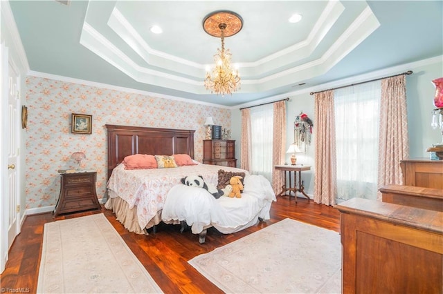 8116 Glengarriff Rd, Clemmons, NC 27012 - bedroom featuring a tray ceiling, a chandelier, dark wood-style floors, and ornamental molding