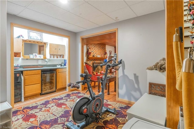 8116 Glengarriff Rd, Clemmons, NC 27012 - exercise area with wine cooler, bar area, and a paneled ceiling