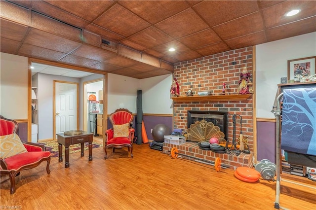 8116 Glengarriff Rd, Clemmons, NC 27012 - sitting room with wood finished floors, recessed lighting, and a fireplace