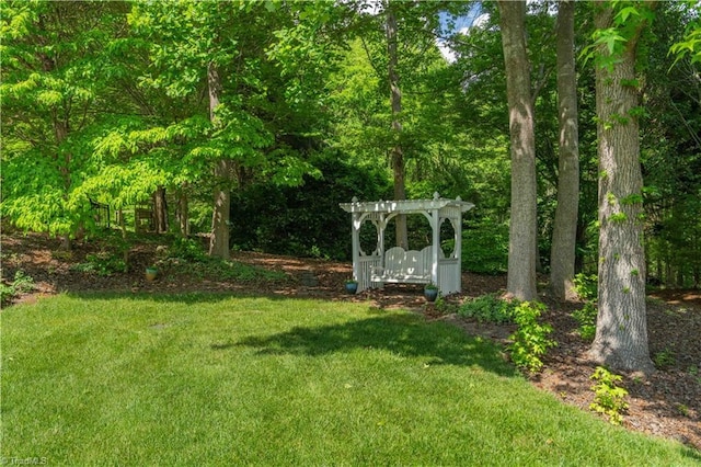 8116 Glengarriff Rd, Clemmons, NC 27012 - view of grassy yard with a pergola