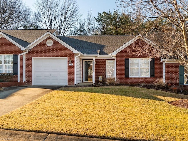 single story home with a garage and a front lawn