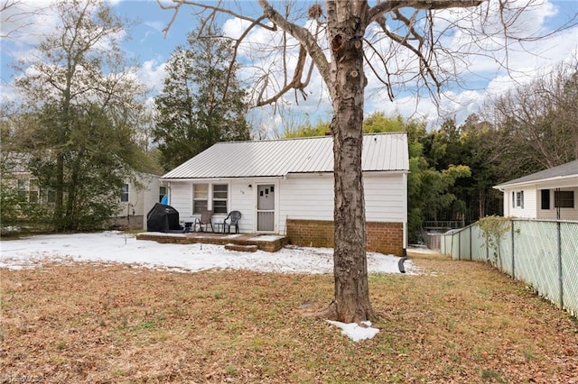 rear view of house with a patio area and a yard