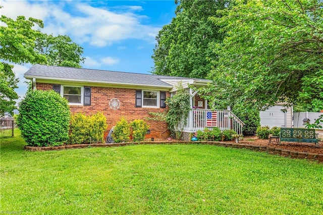 3972 Shadydale Acres Ln, Trinity, NC 27370 - view of front of home with a front lawn, brick siding, and roof with shingles