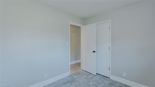 unfurnished bedroom with a closet