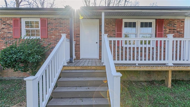 doorway to property with covered porch